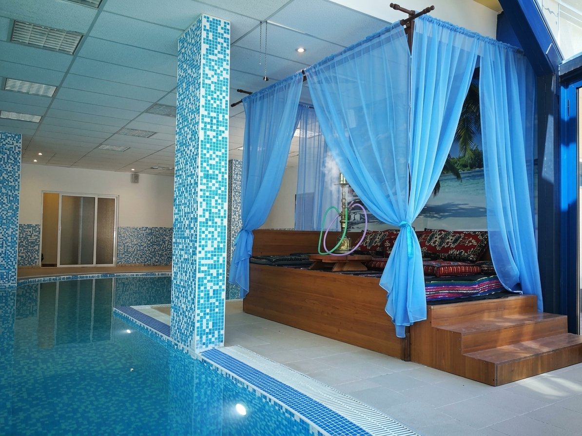 Relaxation pool with a cushioned canopy daybed